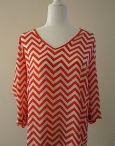 Kiara brand chevron-style blouse, size large.